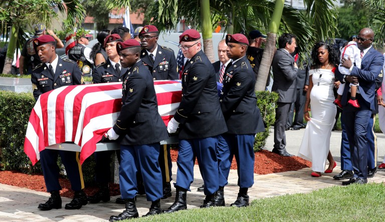 Myeshia Johnson, the wife of Army Sgt. La David Johnson, follows his casket during his burial in Florida. Sgt. Johnson was killed with three other colleagues in an ambush by extremists in Niger on Oct. 4. (Mike Stocker/South Florida Sun-Sentinel via AP)