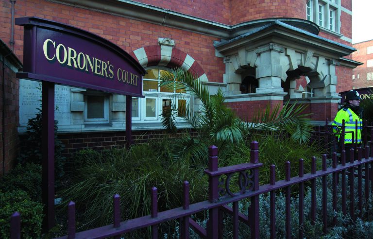 A policeman stands on duty outside Westminster Coroner's Court where the initial inquest into nurse Jacintha Saldanha's death is being opened, in London,Thursday, Dec. 13, 2012. Saldanha, the nurse who passed a hoax call into the hospital room of the pregnant Duchess of Cambridge, apparently killed herself three days later, with a coroner's officer saying Tuesday she was found hanging by the neck and a detective saying she left three notes. (AP Photo/Alastair Grant)