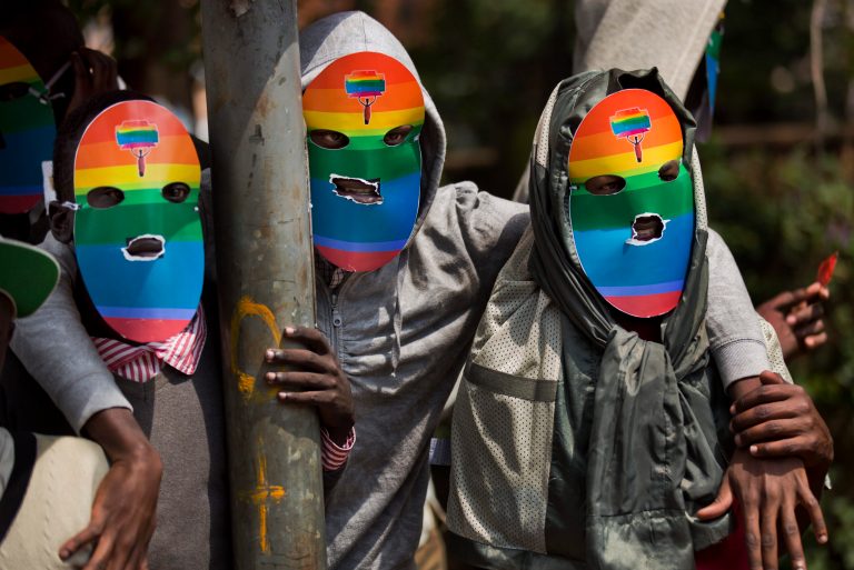 Kenyan gays and lesbians and others supporting their cause wear masks to preserve their anonymity as they stage a rare protest, against Uganda's increasingly tough stance against homosexuality and in solidarity with their counterparts there, outside the Uganda High Commission in Nairobi, Kenya Monday, Feb. 10, 2014. Homosexuality has been criminalized in Uganda where lawmakers have recently passed a new bill, which appears to have wide support among Ugandans, that prescribes life imprisonment for "aggravated" homosexual acts. (AP Photo/Ben Curtis)