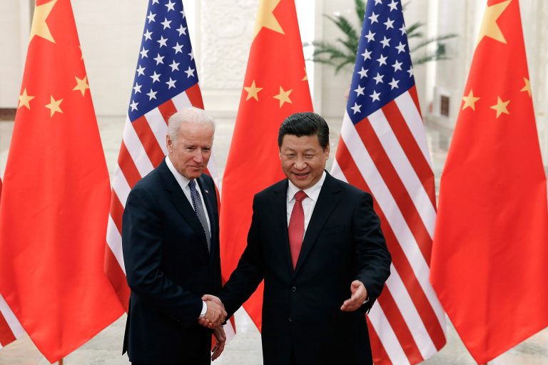 Chinese President Xi Jinping, right, shakes hands with U.S Vice President Biden, left, as they pose for photos at the Great Hall of the People in Beijing, China, Wednesday, Dec. 4, 2013. (AP Photo/Lintao Zhang, Pool)