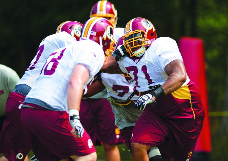 Evan Vucci/AP
Washington Redskins left tackle Trent Williams, right, is one of three starting offensive linemen who are healthy.