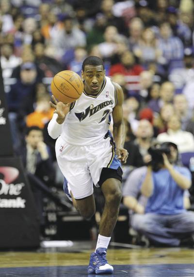 Rob Carr/Getty Images
John Wall averaged 16.4 points, 8.3 assists and 4.6 rebounds as a rookie last season.