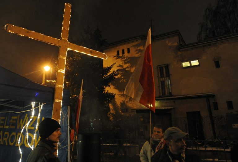   Opponents of Poland's last communist leader Gen. Wojciech Jaruzelski attend an annual rally in front of his house in Warsaw, Poland, Thursday, Dec. 13, 2012 to mark the anniversary of the martial law he imposed on Poland 31 years ago, a repressive crackdown against Lech Walesa's Solidarity movement in an attempt to crush the proponents of democracy. Several hours earlier Jaruzelski, 89, was hospitalized with a heavy nosebleed. (AP Photo/Alik Keplicz)  