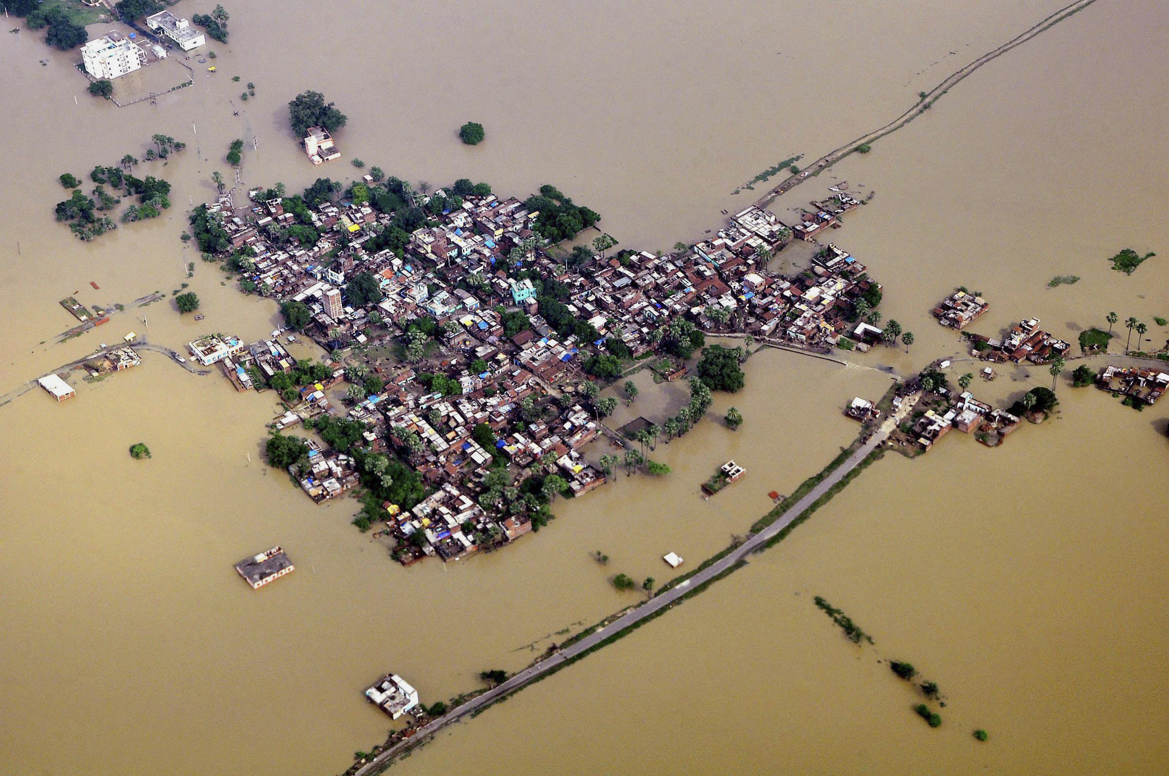 180 dead as floods wash away homes in Nepal, India