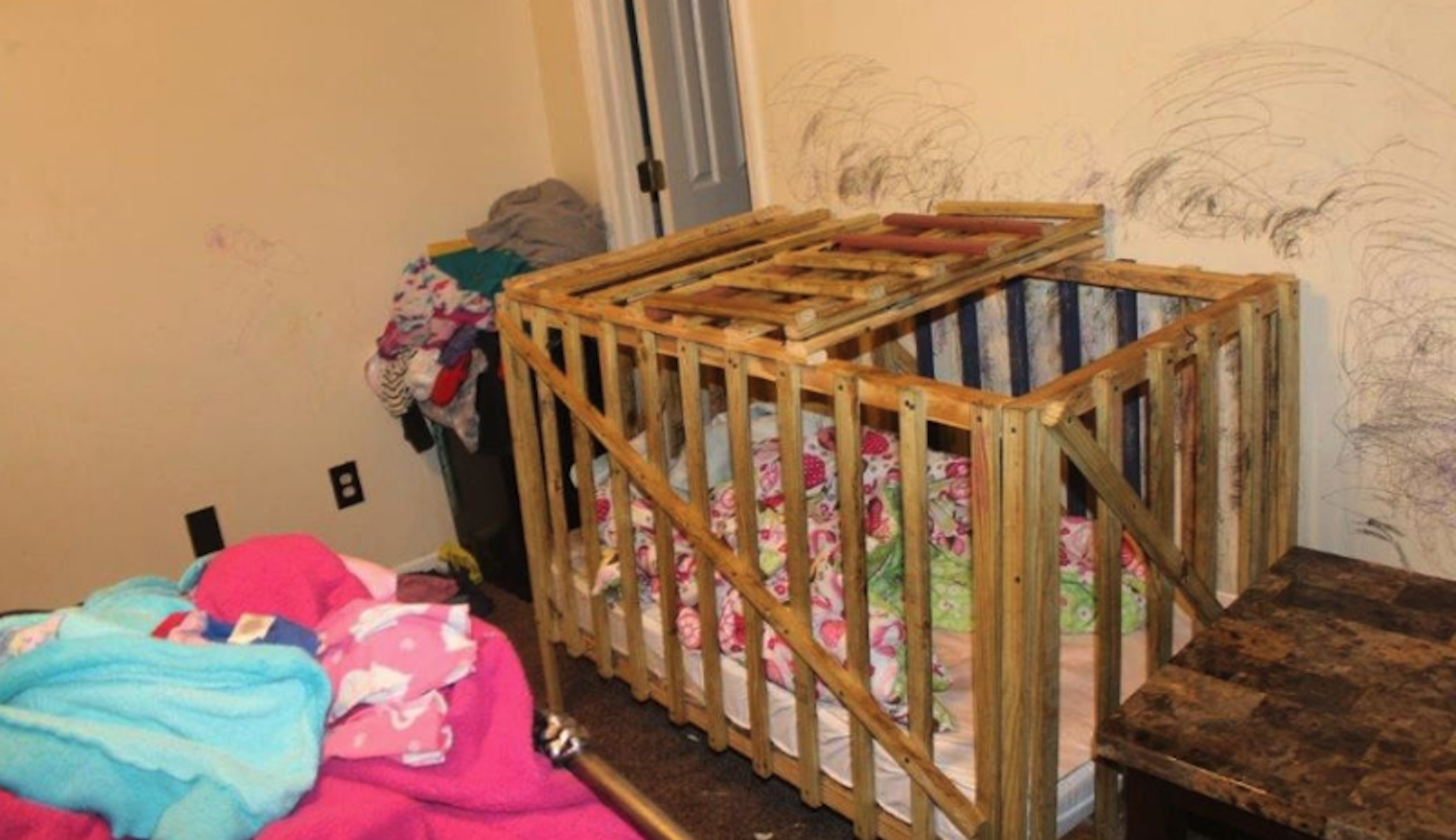 Man named James Bond and two others allegedly held children in ‘cages’ at Alabama home