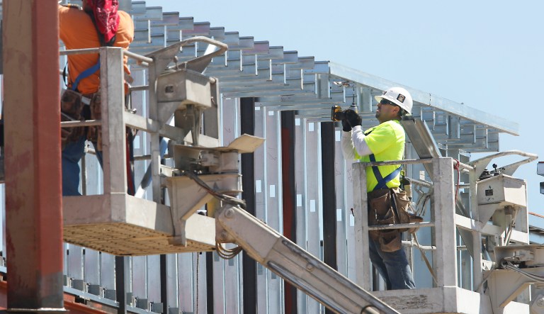 Workers work on a building under construction in Sacramento, Calif., Friday, Aug. 16, 2013. California's unemployment rate increased slightly to 8.7 percent in July, the first rise in unemployment since the spring  of 2011. Construction lost 7,000 jobs with mining, logging and government employment also dropping in July.