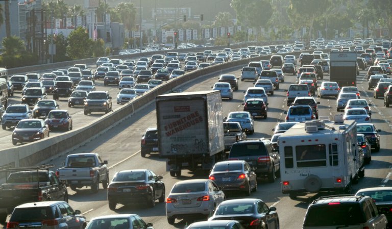 This Sept. 9, 2016 photo shows rush hour traffic moving along the Hollywood Freeway in Los Angeles. California's traffic-locked roads are being considered for their potential to serve a new purpose as clear power producers.