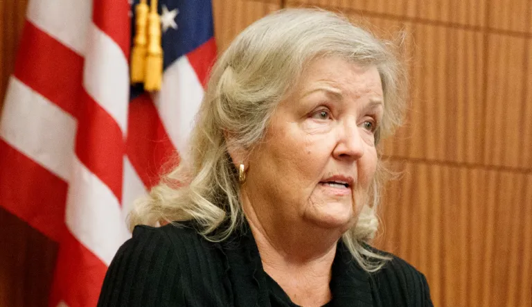 Republican presidential nominee Donald Trump listens to Democratic presidential nominee Hillary Clinton during the second presidential debate at Washington University in St. Louis, Sunday, Oct. 9, 2016.