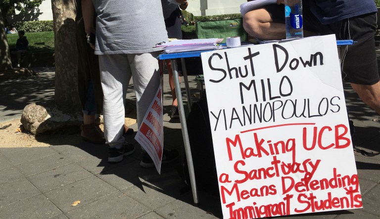 In this Sept. 21, 2017 photo, a group has put up flyers and a booth on Sproul Plaza calling for protesters to "Shut Down Milo Yiannopoulos," at the University of California, Berkeley campus in Berkeley, Calif. Right-wing showman Milo Yiannopoulos is holding a "Free Speech Week" at the University of California, Berkeley with a planned lineup including conservative firebrands Steve Bannon. The university says it has no confirmation the headline acts will appear but is preparing strong security to head off any more violent protests at the liberal campus.