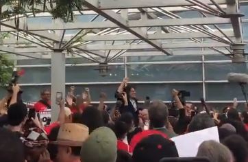 Rally at Reagan National Airport features protesters and presidential candidates