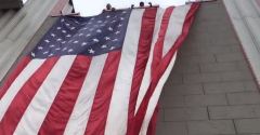 Woman arrested after setting 9/11 memorial flag on fire
