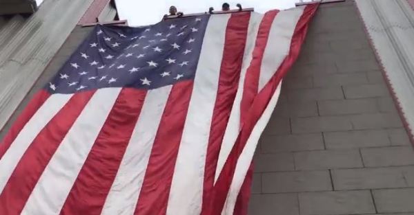 Woman arrested after setting 9/11 memorial flag on fire