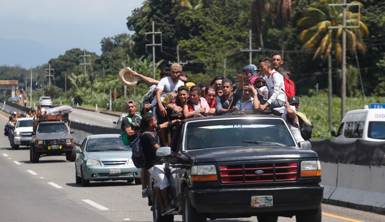 Central American migrants making their way to the U.S. in a large caravan fill the truck of a driver who offered them the free ride, as they arrive to Tapachula, Mexico, Sunday, Oct. 21, 2018. Despite Mexican efforts to stop them at the Guatemala-Mexico border, about 5,000 Central American migrants resumed their advance toward the U.S. border Sunday in southern Mexico.