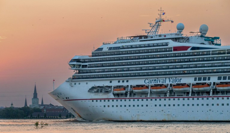 The Carnival cruise ship Valor heads up the Mississippi River in New Orleans, Wednesday, April 8, 2020, during the coronavirus pandemic. A passenger was recently rescued after falling overboard from the Valor and spending about 15 hours in the sea.