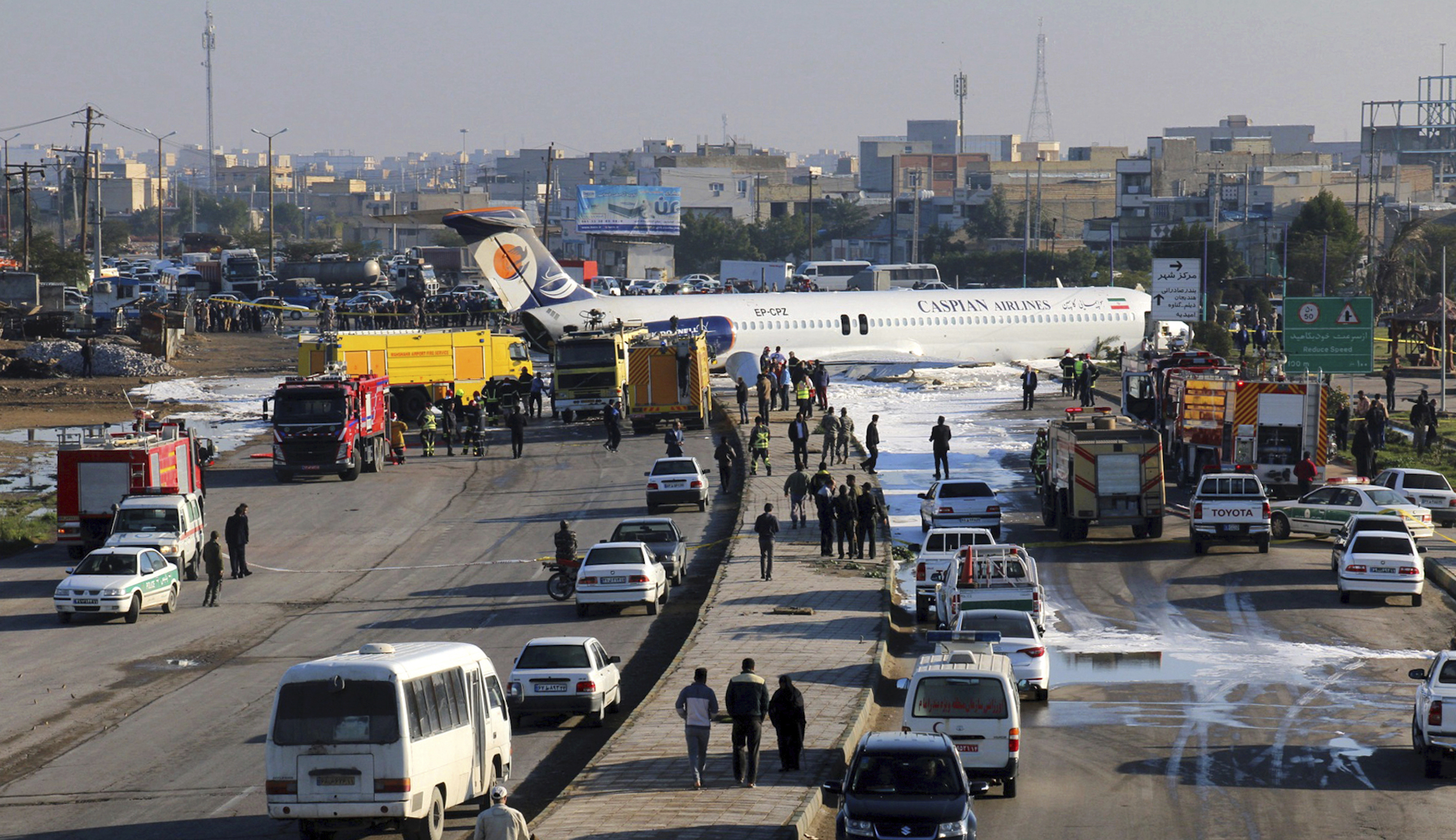 Iranian airliner carrying 144 skids onto major highway in crash landing