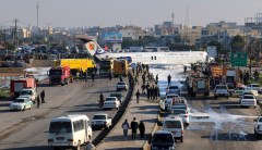 Iranian airliner carrying 144 skids onto major highway in crash landing