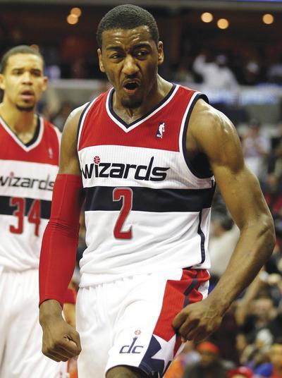 Rob Carr/Getty Images
After Monday's career performance, Wizards point guard John Wall is averaging 15.2 points and 7.2 assists this season.