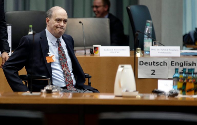 The former  US National Security Agency, NSA, employee William Binney, in wheelchair, arrives for his questioning by the German parliamentary NSA investigation committee in Berlin, Germany, Thursday, July 3, 2014. Picture taken trough a window. The committee investigates  the NSA  surveillance  activities, that also included the tapping of German Chancellor Angela Merkel. (AP Photo/Michael Sohn)