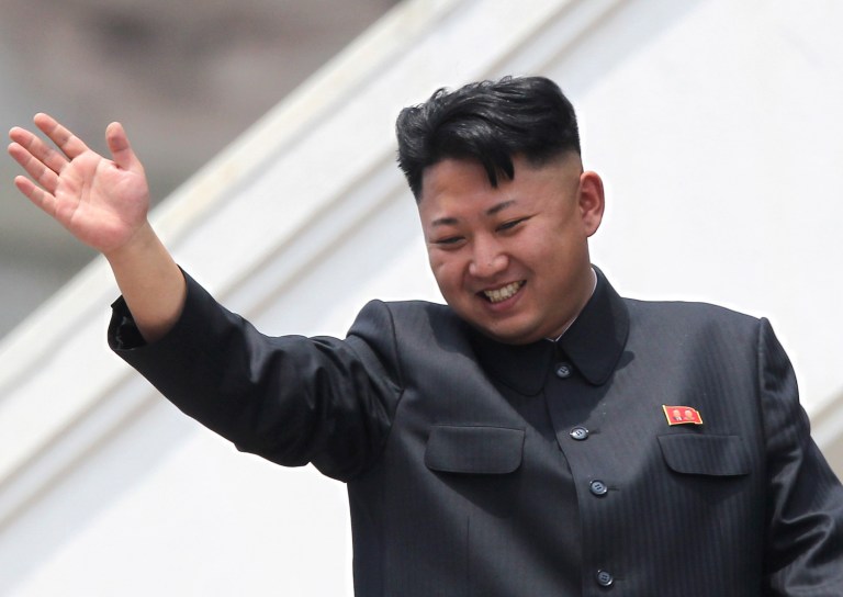 In this Saturday, July 27, 2013 photo, North Korean leader Kim Jong Un waves to war veterans during a mass military parade celebrating the 60th anniversary of the Korean War armistice in Pyongyang, North Korea. A Malaysian university faced public criticism Thursday for awarding an honorary doctorate in economics to North Korean leader Kim Jong Un, whose country is among the poorest in the world. (AP Photo/Wong Maye-E)