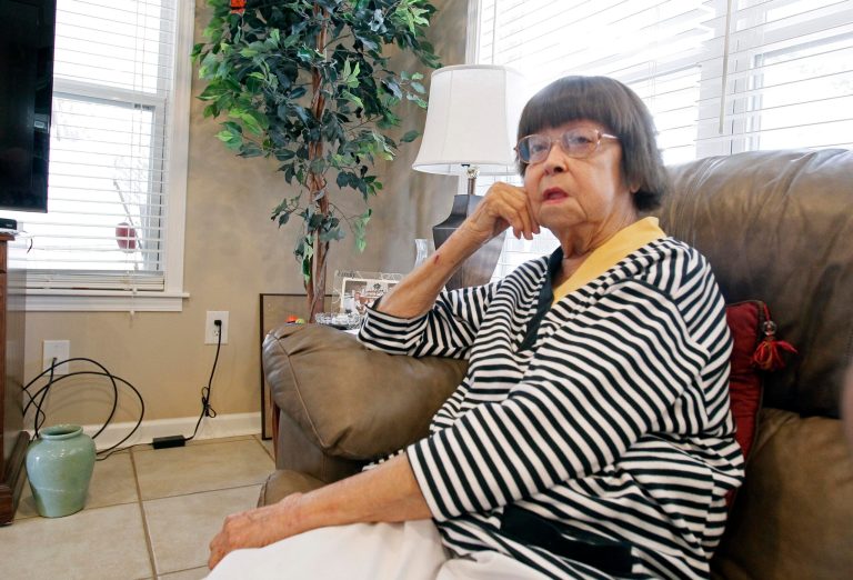   In this March 1, 2012 photograph, Helen Walker is interviewed at her Biloxi, Miss., home, about the quiet piece of wooded land in south Mississippi she owned and her plans to pass it on to her son, Jim Walker Jr. However, a portion of her property Harrison County Utility Authority decided to take for a sewage project, sparking a contentious legal battle between the 86-year-old woman and an agency in control of $234 million in Hurricane Katrina grants. (AP Photo/Rogelio V. Solis)  