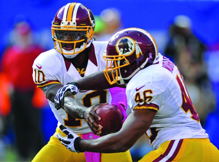 Bill Kostroun/AP
With rookie Robert Griffin III as the Redskins starting quarterback this season, Comcast SportsNet has seen ratings of its postgame show go up 50 percent.