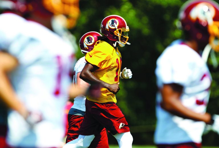 Carolyn Kaster/AP
Washington Redskins veterans were impressed by Robert Griffin III during the rookie quarterback's first day of training camp.