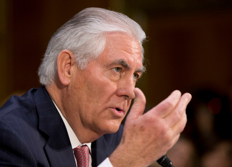The protesters believe that Tillerson's corporate background endangers the environment and amounts to war profiteering. (AP Photo/Steve Helber)