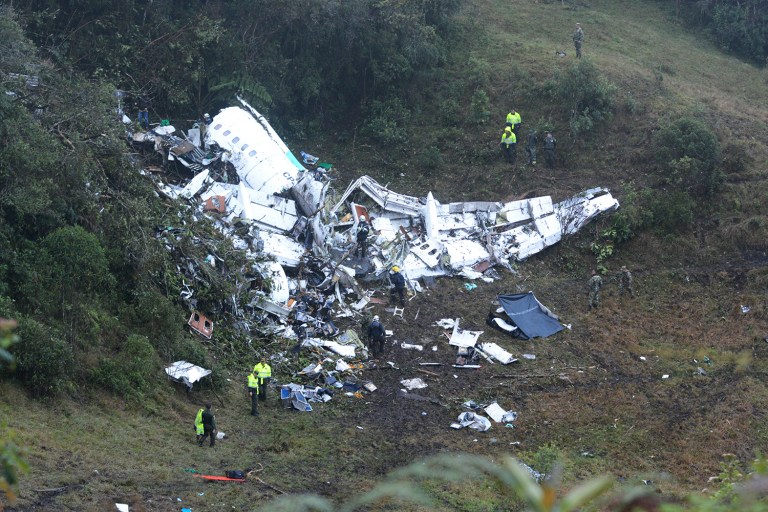 Police officers and rescue workers search for survivors around the wreckage of a chartered airplane that crashed in La Union, a mountainous area outside Medellin, Colombia. The plane was carrying the Brazilian first division soccer club Chapecoense team that was on its way for a match. (AP Photo/Luis Benavides)