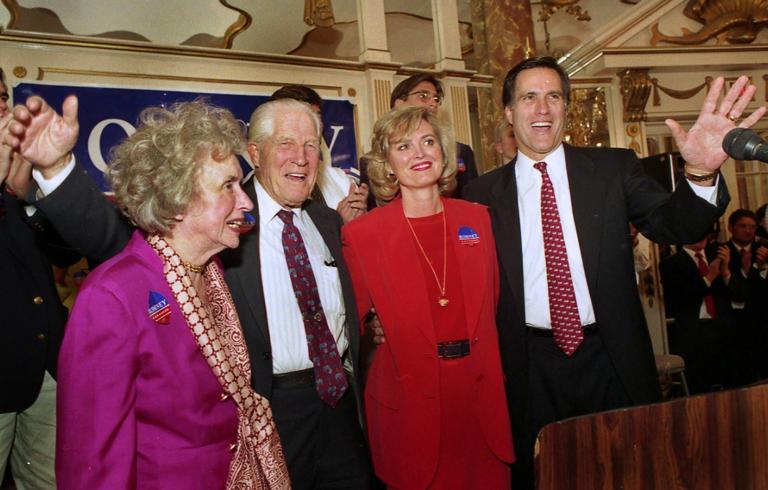 n this Feb. 2, 1994 file photo, Mitt Romney, right, chairman of the Boston-based management consulting firm Bain and Company, acknowledges the crowd after announcing his candidacy as a Republican for the U.S. Senate seat held by Sen. Edward Kennedy, D-Mass, in Boston. With Romney on stage are, from left to right, his mother Lenore Romney, his father George Romney, former governor of Michigan and one-time presidential candidate, and wife Ann. (AP Photo/Jon Chase, File)