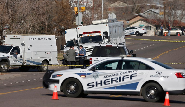 The suspect ran behind a home and as deputies caught up, then pulled out a handgun and shot at law enforcement, the Adams County Sheriff's Department said in a statement early Thursday. (AP Photo/Brennan Linsley)