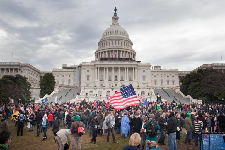 Protesters converged on Capitol Hill on Tuesday in one of the largest Occupy demonstrations the District has seen. 