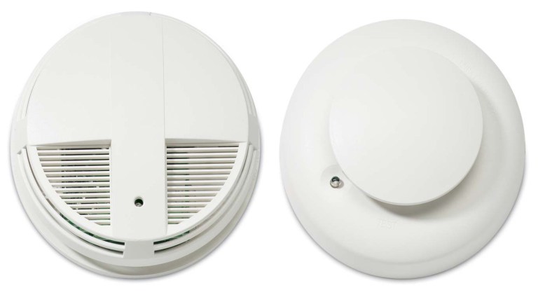 This undated combo image made from images provided by the U.S. Consumer Product Safety Commission shows an ESL and Interlogix smoke detector 400 series, left, and an ESL and Interlogix smoke detector 500 series. Radio frequency interference can cause the smoke detectors to fail to alert consumers of a fire. (AP Photo/U.S. Consumer Product Safety Commission)