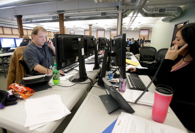 Guides work the phone bank at MnSure, Minnesota's health insurance marketplace, in St. Paul, Minn, on Dec. 31. (AP Photo/Jim Mone)