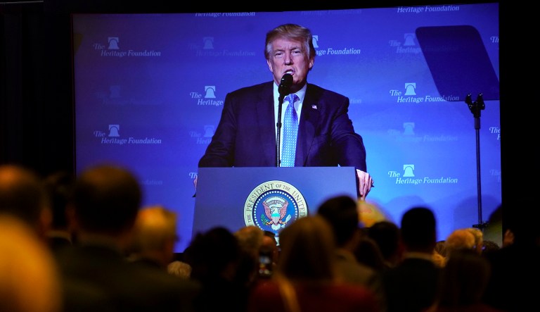 President Donald Trump's image is seen projected on a screen as he speaks at the Heritage Foundation's annual President's Club meeting, Tuesday, Oct. 17, 2017 in Washington. (AP Photo/Pablo Martinez Monsivais)