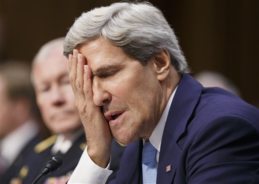 Secretary of State John Kerry shows frustration at questioning from Sen. Rand Paul, R-Ky., at a Senate Foreign Relations Committee hearing about President Barack Obama's request for congressional authorization for military intervention in Syria, a response to last month's alleged sarin gas attack in the Syrian civil war, on Capitol Hill in Washington, Tuesday, Sept. 3, 2013. At left is Joint Chiefs Chairman Gen. Martin Dempsey. (AP Photo/J. Scott Applewhite)