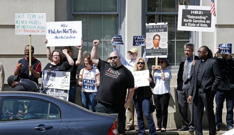 Neither the North Carolina law nor the Mississippi law places new burdens on anyone or deprives them of rights they enjoyed hitherto. Rather, each merely preserves a status quo to which opponents have principled objections. (AP Photo/Gerry Broome)