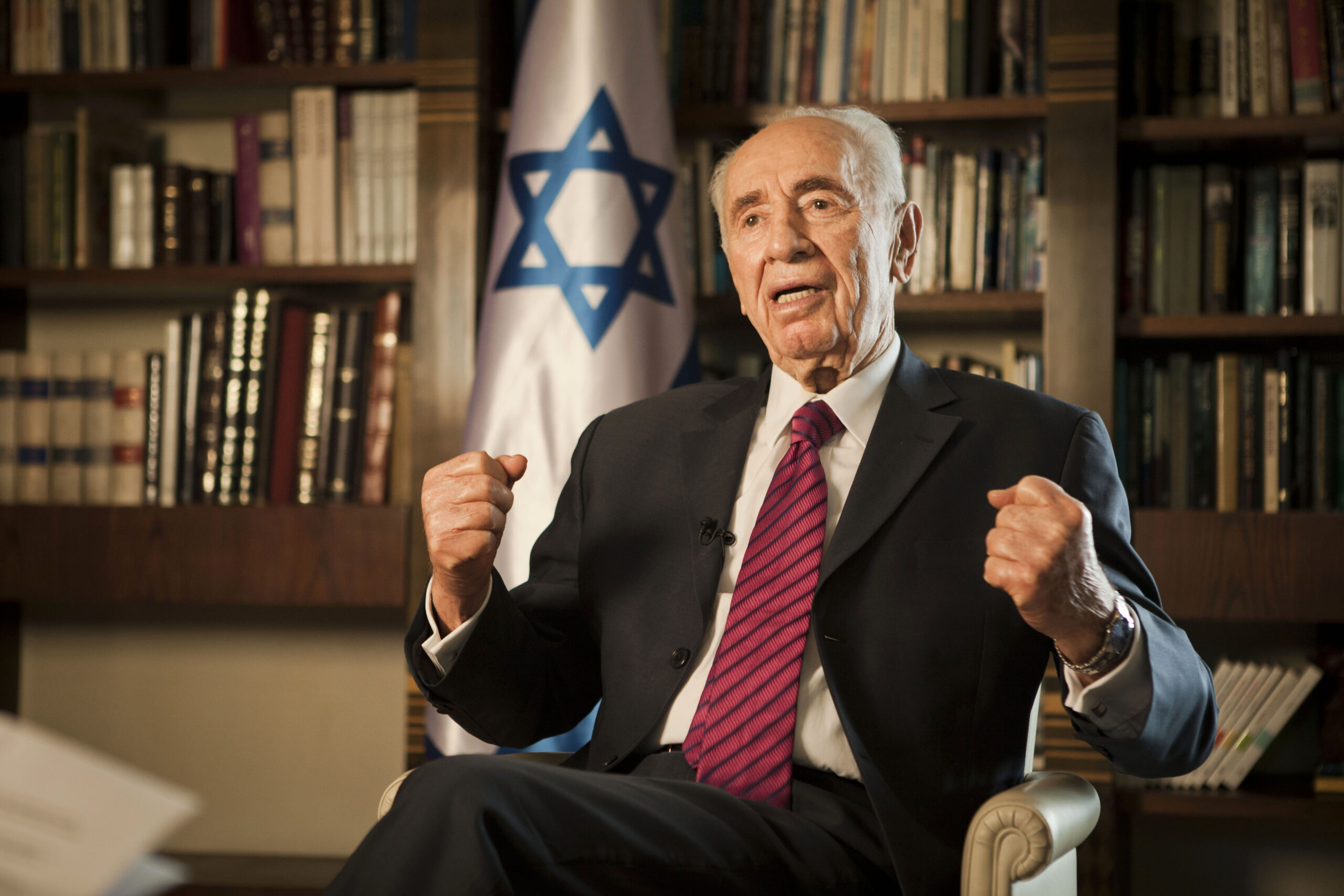 AP INTERVIEW: Israel’s Peres defends airstrikes