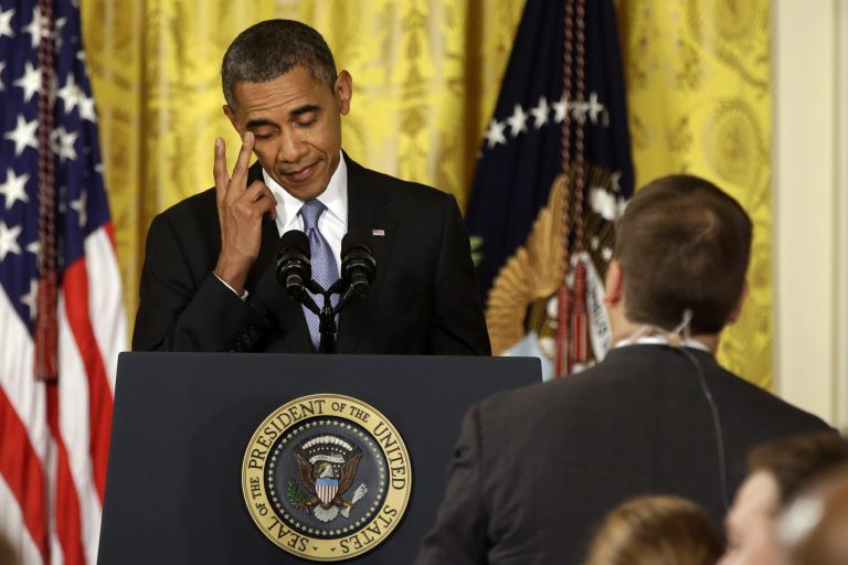 President Obama rubs his eye as he listens to a question from a reporter during a news conference in the East Room of the White House on Friday. (AP/Jacquelyn Martin)