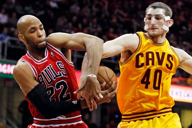   Chicago Bulls' Taj Gibson (22) and Cleveland Cavaliers' Tyler Zeller (40) battle for the ball in the second quarter of an NBA basketball game, Wednesday, Dec. 5, 2012, in Cleveland. (AP Photo/Tony Dejak)  