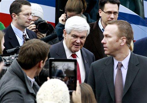 Republican presidential candidate, former House Speaker Newt Gingrich campaigns on primary election day outside of a polling station at Webster School in Manchester, N.H., Tuesday, Jan. 10, 2012. 