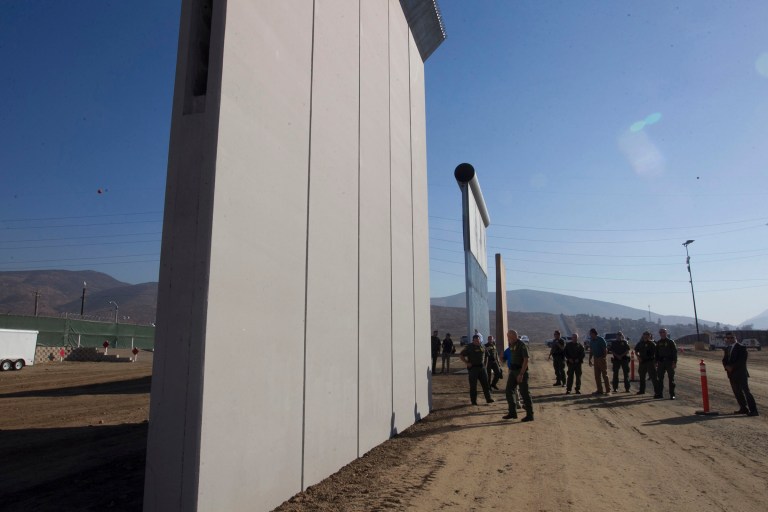 Ronald Vitiello, U.S. Customs and Border Protection's acting deputy commissioner, tours the construction site where several prototypes of a border wall were constructed on Thursday, Oct. 26, 2017, in San Diego. (John Gibbins/The San Diego Union-Tribune via AP, Pool)