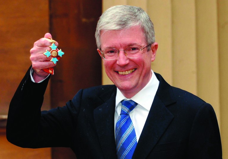 FILE - In this file photo dated May 24, 2006, Tony Hall, chief executive of the Royal Opera House in London receives a CBE. The BBC has chosen a former head of its news division to lead the broadcaster as it struggles to recover from a child abuse scandal. Tony Hall, currently chief executive of the Royal Opera House, was announced as the BBC's new director-general on Thursday Nov. 22, 2012. (AP Photo/PA, Stefan Rousseau, file) UNITED KINGDOM OUT NO SALES NO ARCHIVE