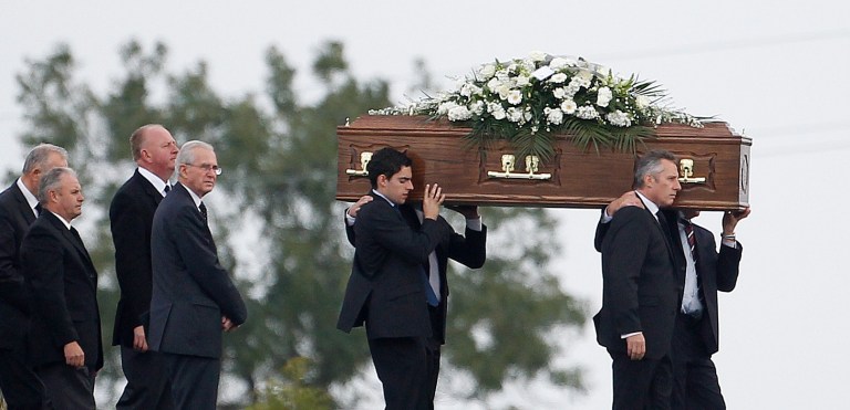 Ian Paisley jnr, right, carries the coffin of his father Ian Paisley for burial at Ballygowan Free Presbyterian church, Ballygowan, Northern Ireland, Monday, Sept. 15, 2014.  The funeral of Ian Paisley, the former Democratic Unionist Party leader and first minister of Northern Ireland, took place Monday, He was buried following a private funeral service at his family home in east Belfast. Dr Paisley, who stepped down from politics in 2008, passed away on Friday following a short illness aged 88.  (AP Photo/Peter Morrison)