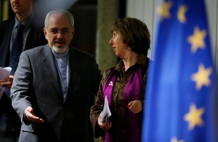 Iranian Foreign Minister Mohammad Javad Zarif, left, gestures to Catherine Ashton, the European Union's foreign policy chief, as they arrive at a press conference at the end of the Iranian nuclear talks in Geneva, Sunday, Nov. 10, 2013. The European Union's top diplomat and Iran's foreign minister said nuclear talks between six world powers and Tehran did not seal a deal. (AP Photo/Jason Reed, Pool)