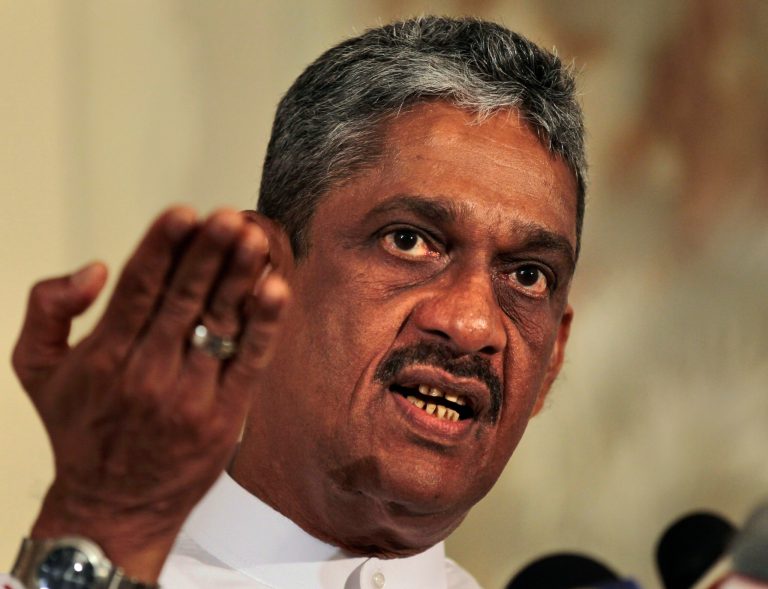   Sri Lanka's former army chief Sarath Fonseka gestures while speaking during a media briefing in Colombo, Sri Lanka, Thursday, June 14, 2012. Sri Lanka's ex-army chief turned opposition leader is vowing to topple the government, saying the present regime is corrupt and dictatorial. (AP Photo/Eranga Jayawardena)  