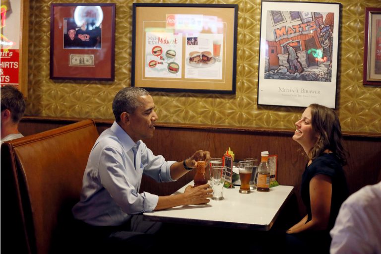 President Barack Obama talks with Rebekah Erler, of Minneapolis at Matts Bar before going to a town hall meeting at Minnehaha Park, Thursday, June 26, 2014, in Minneapolis. The president is in Minneapolis for the first in a series of Day-in-the-Life visits he pans to make across the country this summer. (AP Photo/The Star Tribune, Jerry Holt, Pool)