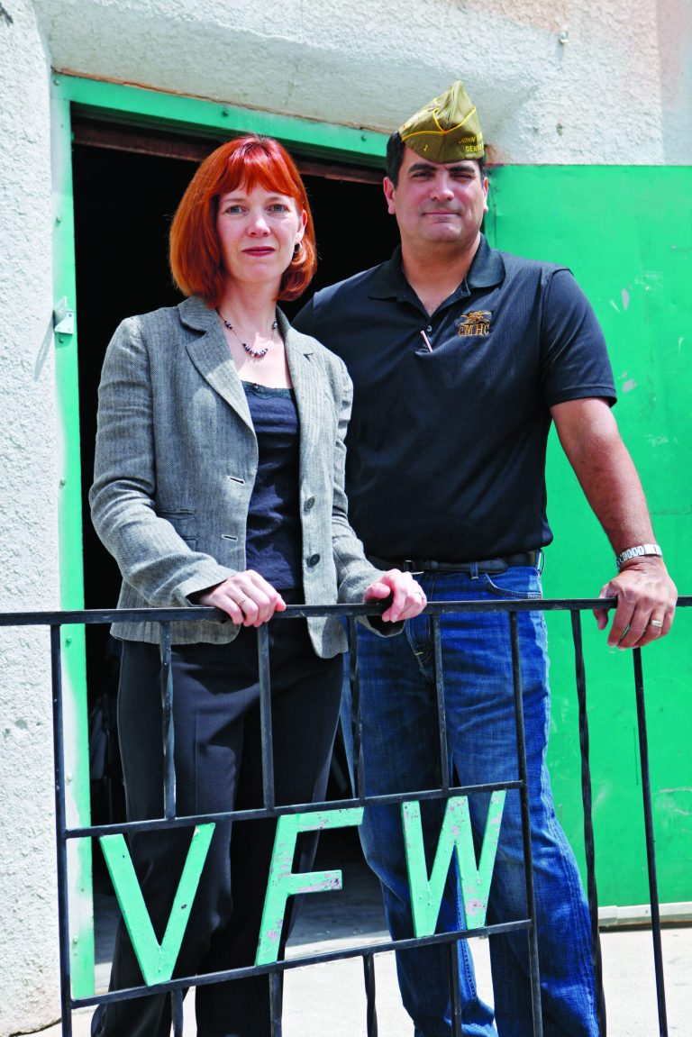 In this Tuesday, June 5, 2012 photo Brenda Smull public affairs officer for VFW Post 1 and post commander Izzy Abbass pose for their photo on the steps of the facility in Denver. The VFW's oldest chapter, Post 1, in Denver, is reorganizing itself around the needs of the new veterans. Its new building is currently being remodeled and won't have a full-time bar. (AP Photo/Ed Andrieski)