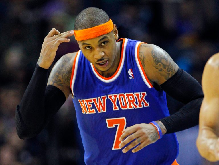   New York Knicks' Carmelo Anthony (7) reacts after making a 3-pointer against the Charlotte Bobcats during the first half of an NBA basketball game in Charlotte, N.C., Wednesday, Dec. 5, 2012. (AP Photo/Chuck Burton)  