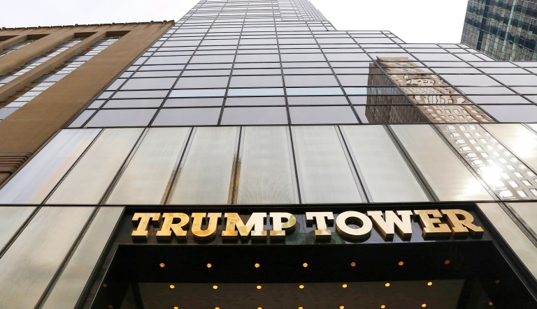 Marching across the Brooklyn Bridge to Trump Tower, located in Manhattan, Haitians and Haitian-Americans waved their flags, danced along to drums and horns, and chanted to show their anger towards President Trump. (AP Photo/Mark Lennihan)