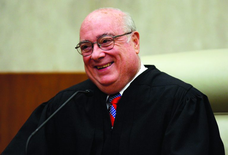 HOLD FOR RELEASE AFTER 6:30 P.M. EST AND THEREAFTER ON SUNDAY, NOV. 11, 2012 - FILE - In this May 1, 2008, photo, Chief Judge Royce Lamberth of the U.S. District Court in Washington is pictured during a ceremony where the title of chief judge for the U.S. District Court in Washington was passed from Judge Thomas F. Hogan to Lamberth at the federal courthouse in Washington. Federal judges across the nation are shouldering criminal caseloads that vary widely in size, sometimes even among judges in the same courthouse, according to a study released Sunday, Nov. 11, 2012. The study by the Transactional Records Access Clearinghouse at Syracuse University found three courthouses where the judge with the largest criminal caseload had sentenced more than twice the number of defendants as the judge with the smallest caseload from October 2006 through July 2012. They were Los Angeles, Beaumont, Texas, and Camden, N.J. On the opposite end, the courthouse in the nation's capital had the lowest average number of criminal defendants sentenced per judge _ 147 over the nearly six years in the study. 